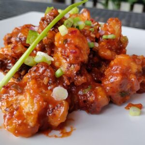 Cauliflower Manchurian Vegan. Cauliflower, chili sauce, garlic, ginger.