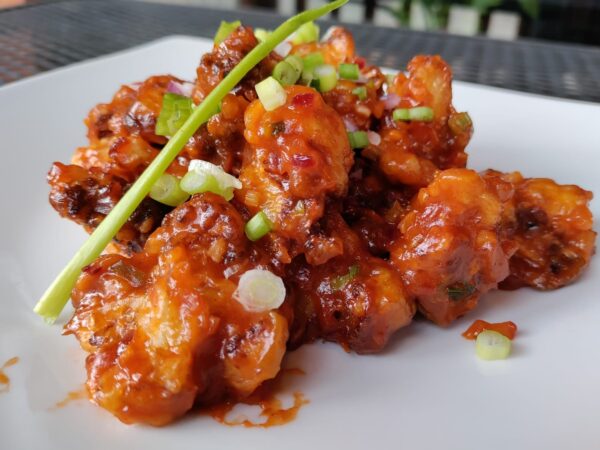 Cauliflower Manchurian Vegan. Cauliflower, chili sauce, garlic, ginger.