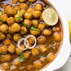 Chana Masala Vegan Chana Masala Curry is a smooth Chickpea or Garbanzo beans curry cooked in onions spices, ginger turmeric cumin, garlic Nut & Gluten free