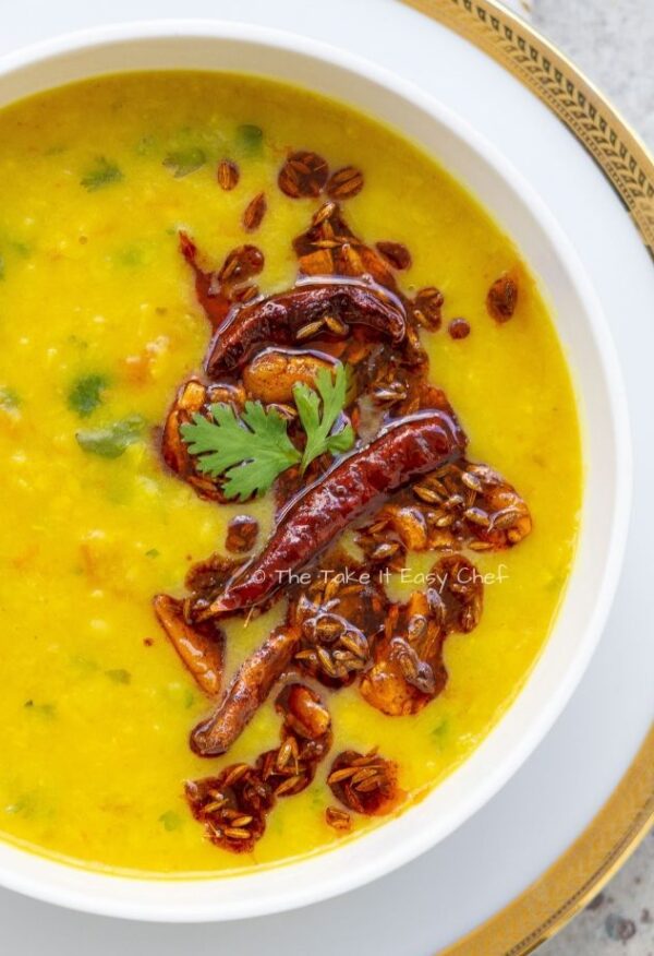 Gluten Free, Vegan Dal Tadka (Lentils)  are slow Cooked Lentil in a onion cumin tomato medley, enjoyed with Rice or Breads or both!