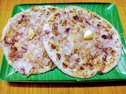 Onion uttapam is a popular and flavorful South Indian breakfast or snack. It's a savory pancake, thicker than a dosa, made from a fermented batter of rice and urad dal (black gram). The hallmark of onion uttapam is the generous topping of finely chopped onions, which are cooked right into the batter as the uttapam sizzles on the griddle.